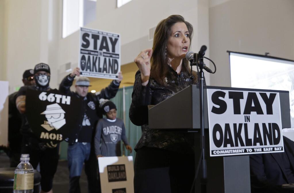 Oakland Mayor Libby Schaaf gestures during a rally to keep the Oakland Raiders from moving Saturday, March 25, 2017, in Oakland. NFL owners are expected to vote on the team's possible relocation to Las Vegas Monday or Tuesday at their meeting in Phoenix. (AP Photo/Eric Risberg)