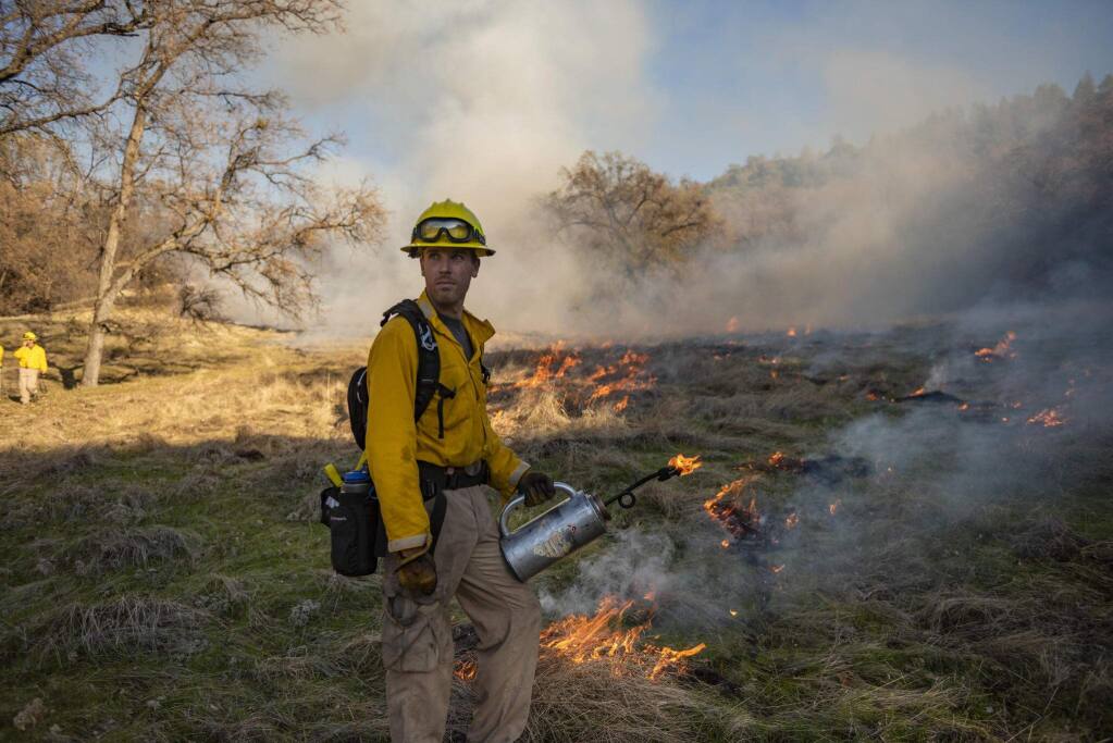 Botany masters student Mitch Bamford participates in 70-acre prescribed burn. (Jason Halley/ CSU, Chico)