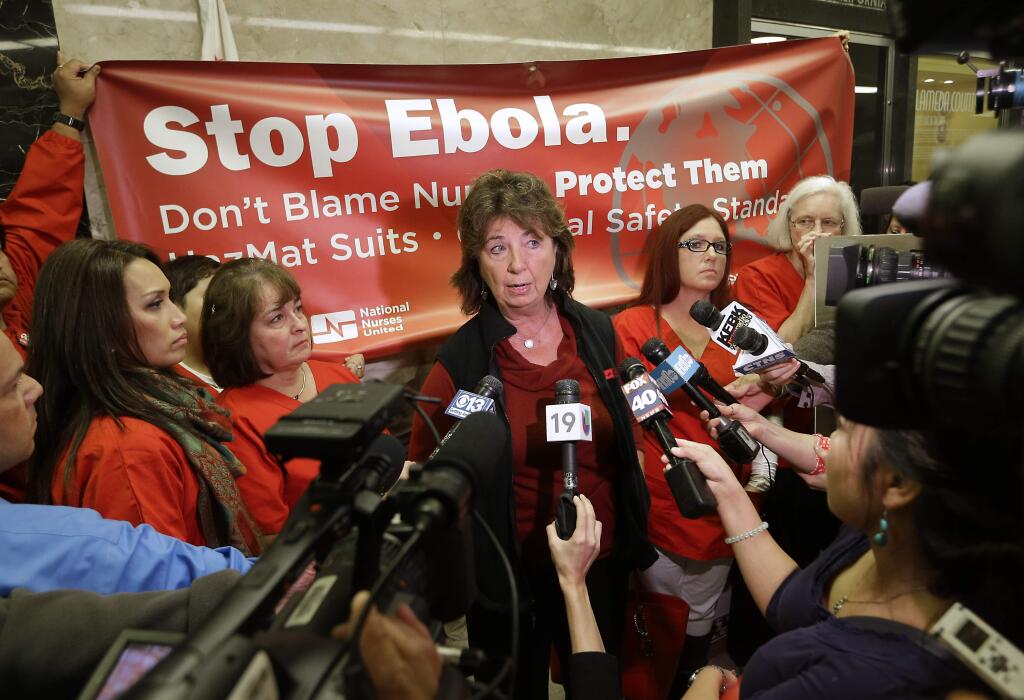 RoseAnn DeMoro, executive director of the California Nurses Association and National Nurses United talks to reporters after meeting with Gov. Jerry Brown to discuss the Ebola crisis, Tuesday, Oct. 21, 2014, in Sacramento, Calif. The Nurses unions, which have highly critical of the response so far, say they want California to be the national leader in enacting the highest Ebola safety standards. (AP Photo/Rich Pedroncelli)