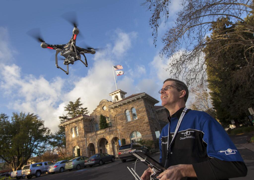Clayton Inskeep, proprietor of Drone-Aviation, demonstrates how he operates one of his drones for aerial photography. Interesting fact: You will need a pilot's license if you want to set up a commercial drone-flying business. (Photos by Robbi Pengelly/Index-Tribune)