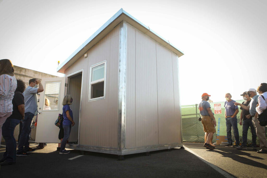 The city of Petaluma and the homeless services nonprofit Committee on the Shelterless unveiled the tiny homes they plan to build at the COTS Mary Isaac Center on Friday, Sept. 17, 2021. The ongoing shipping crisis has put the timely delivery of the needed units in limbo. (CRISSY PASCUAL/ARGUS-COURIER STAFF).
