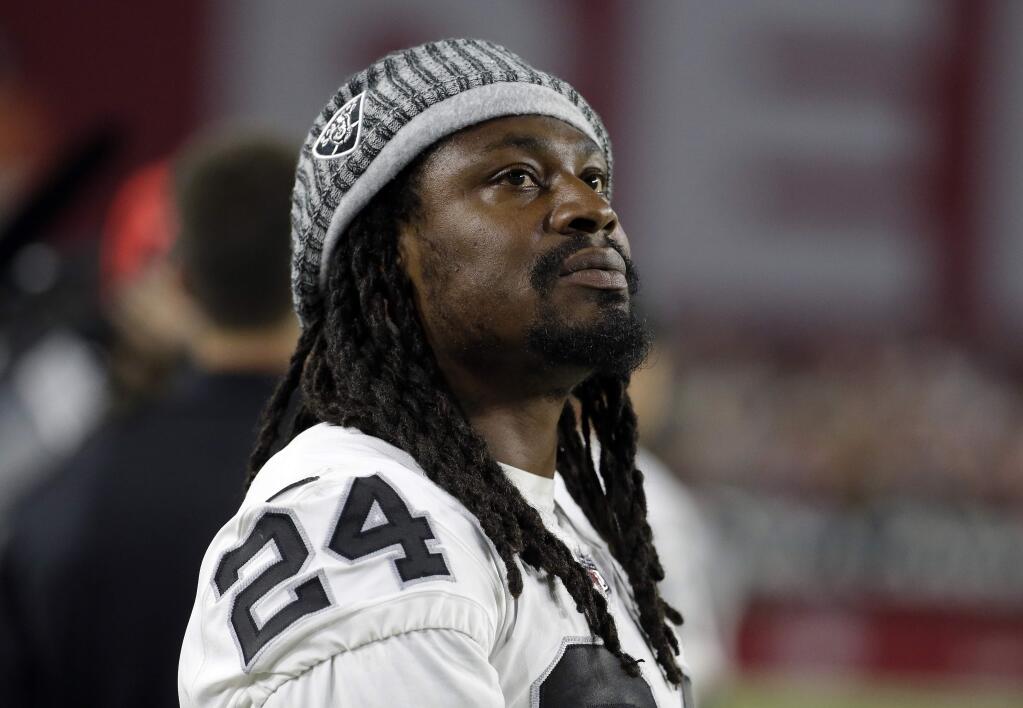 Oakland Raiders running back Marshawn Lynch (24) stands on the sidelines during the second half of an NFL preseason football game against the Arizona Cardinals, Saturday, Aug. 12, 2017, in Glendale, Ariz. (AP Photo/Rick Scuteri)