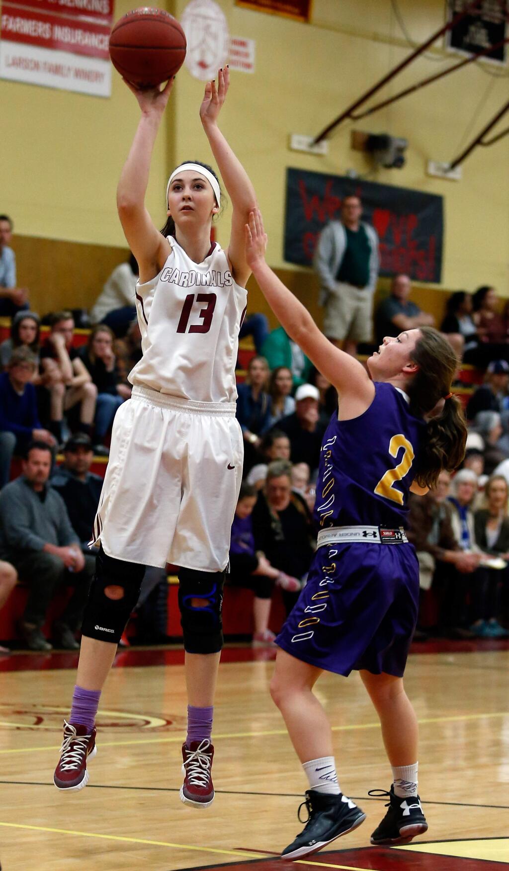Cardinal Newman's Hailey Vice-Neat (13) shoots a jump shot while Middletown's Kaleigh Alves (2) defends during the first half of a NCS Division 4 girls basketball quarterfinal game on Saturday, Feb. 27, 2016. (Alvin Jornada / The Press Democrat)