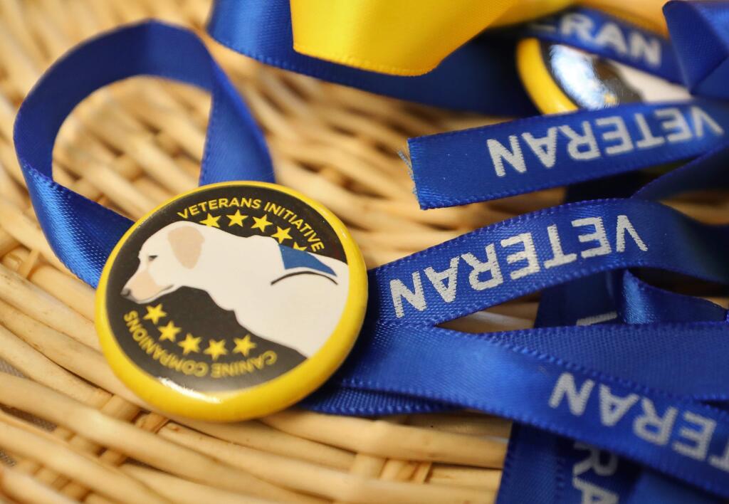 Ribbons for veterans to wear at the Canine Companions for Independence celebration of opening a new training building designed specifically for veterans with post traumatic stress disorder at the campus in Santa Rosa on Tuesday, Dec. 3, 2019. (Christopher Chung/ The Press Democrat)