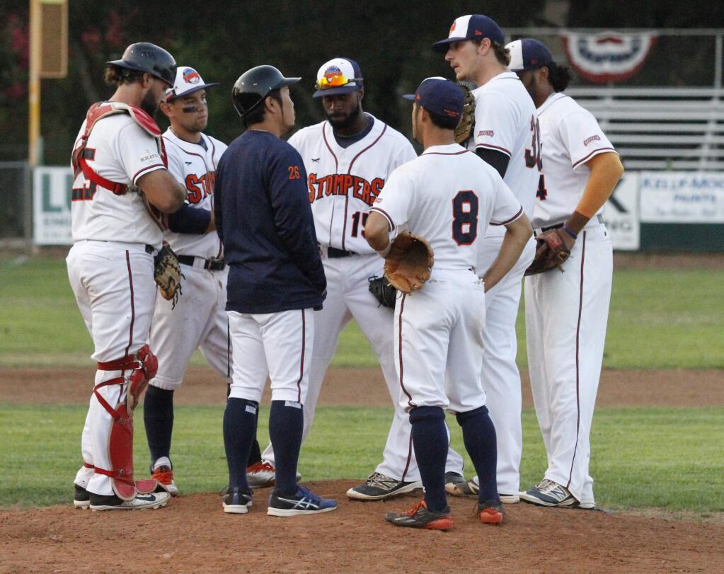 Bill Hoban/Indexc-TribuneStomper Manager Takashi Miyoshi has a meeting on the mound with his infield during a recent game. The Stompers will face the Vallejo Admirals in a one-game playoff for the Pacific Association title at 7:05 p.m. today, Friday, Sept. 1, at Arnold Field.