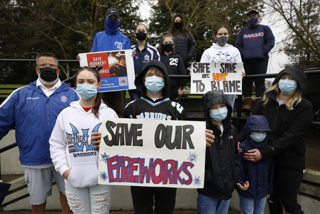 Members of the group "Save Rohnert Park Fireworks" gather for a photo at Golis Park in Rohnert Park on Thursday, March 18, 2021. (Beth Schlanker / The Press Democrat)