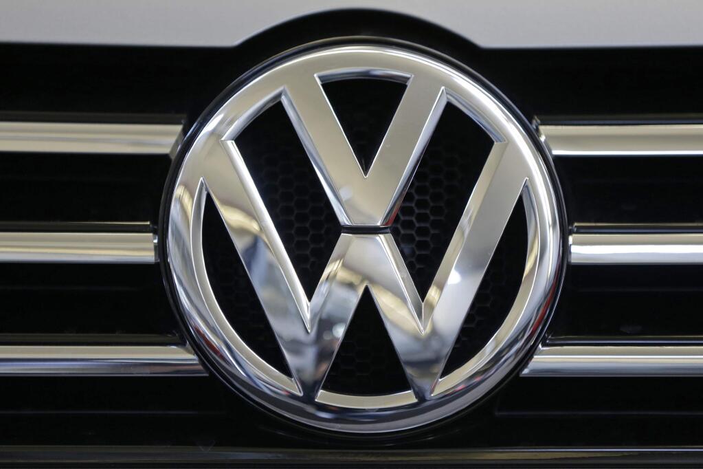 FILE - This Feb. 14, 2013, file photo, shows the Volkswagen logo on the grill of a Volkswagen on display in Pittsburgh. (AP Photo/Gene J. Puskar, File)