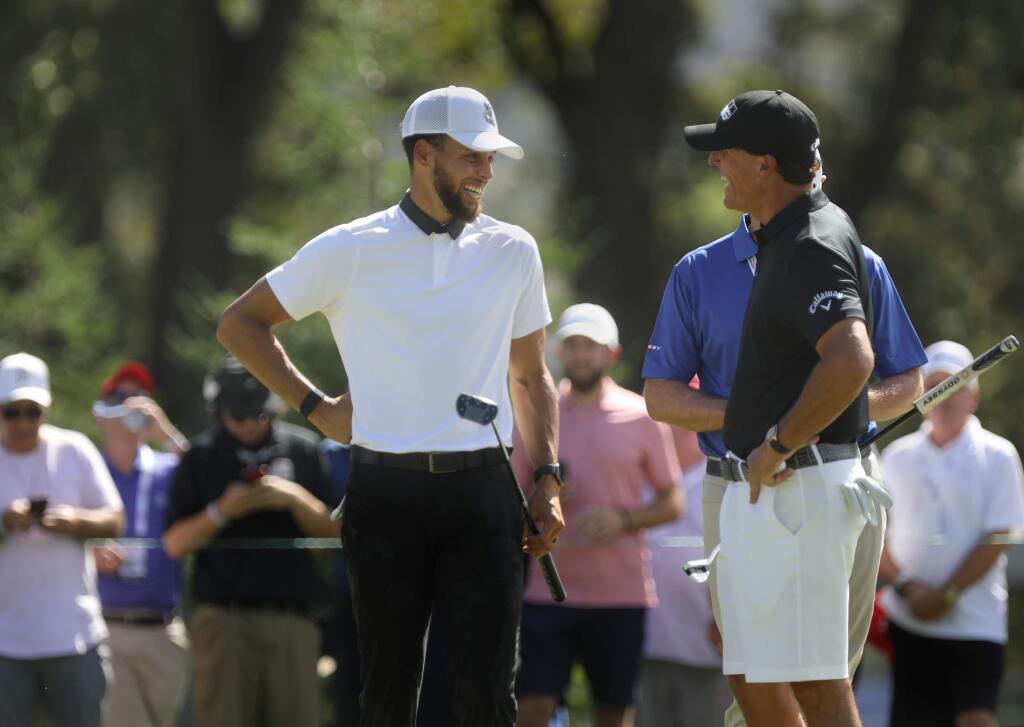 Stephen Curry and Phil Mickelson talk during the Safeway Open Pro-Am at Silverado Resort in Napa on Wednesday, Sept. 25, 2019. (BETH SCHLANKER / The Press Democrat)