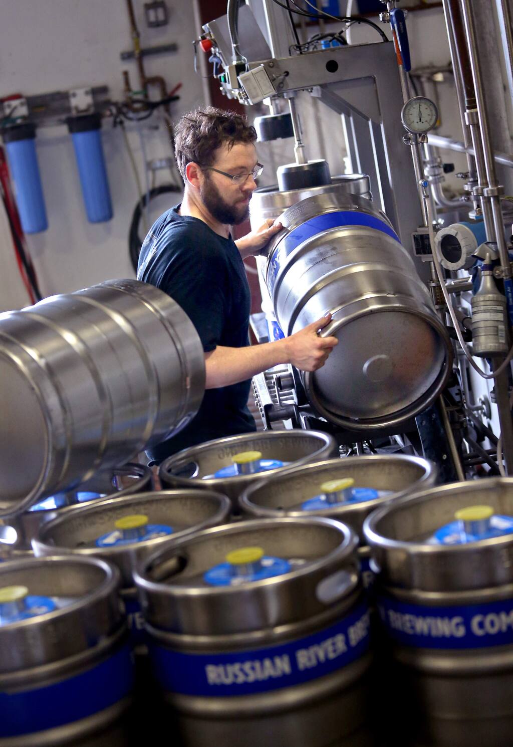 Danny Chamoff fills kegs with Pliny the Younger at the Russian River Brewing Company facility in Santa Rosa on Thursday, February 5, 2015. (Christopher Chung/ The Press Democrat)