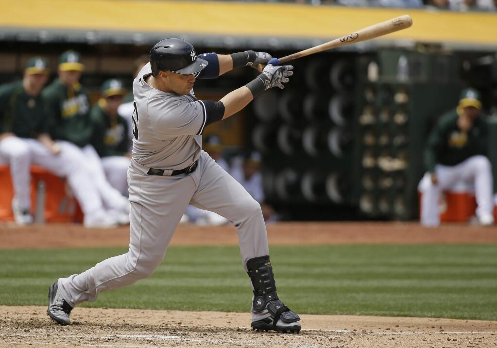New York Yankees' Carlos Beltran hits an RBI single off Oakland Athletics starting pitcher Sean Manaea in the fourth inning Saturday, May 21, 2016, in Oakland. (AP Photo/Eric Risberg)