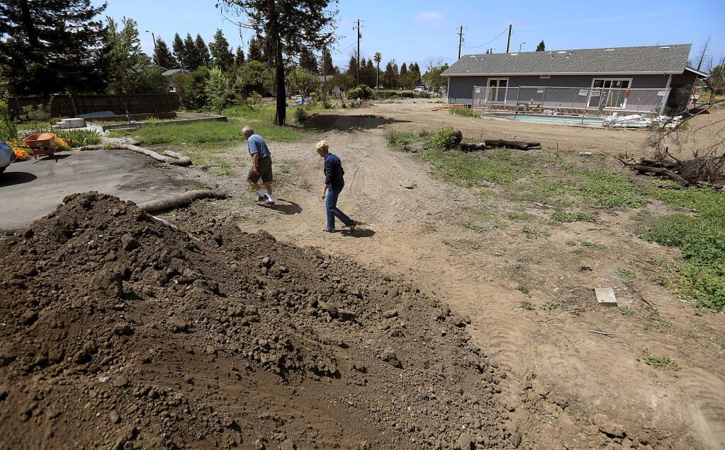 Dave and Sue Sloat's home survived the Tubbs fire in the Coffey Park area, but lost a barn and a granny unit. When the lot was cleared, too much dirt was removed. They were told they needed 40 cubic yards of dirt to fill the deep excavation. (KENT PORTER/ PD)