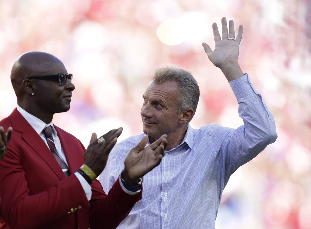 Hall of famers Jerry Rice and Joe Montana are introduced before an NFL football game between the San Francisco 49ers and the Chicago Bears in Santa Clara, Calif., Sunday, Sept. 14, 2014. (AP Photo/Marcio Jose Sanchez)