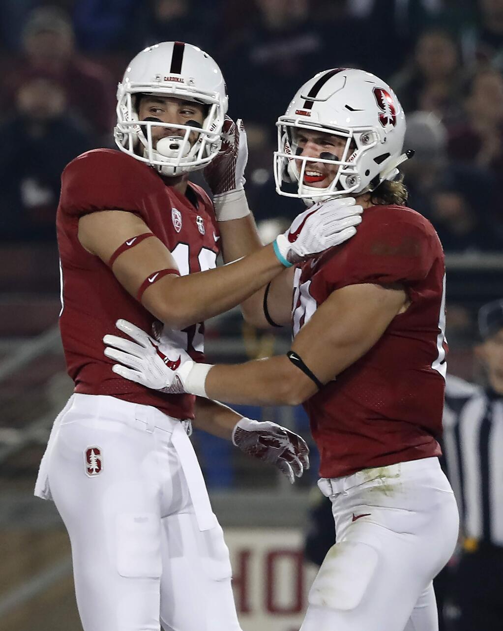 Stanford tight end Colby Parkinson, right, celebrates with Simi Fehoko after catching a touchdown pass against Oregon State in the first half during an NCAA college football game on Saturday, Nov. 10, 2018, in Stanford, Calif. (AP Photo/Tony Avelar)