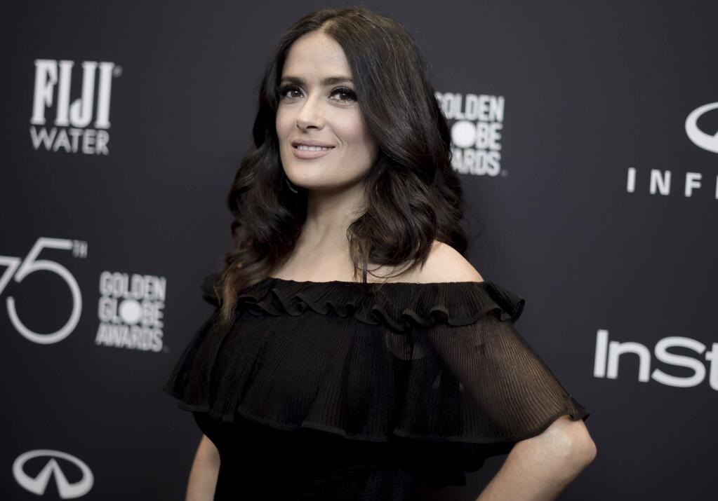 FILE - In this Nov. 15, 2017 file photo, actress Salma Hayek attends the HFPA and InStyle Celebrate the 2018 Golden Globe Awards Season in West Hollywood, Calif. In an op-ed, Hayek says that her refusals of Harvey Weinstein's advances led to a nightmare experience making the 2002 Frida Kahlo biopic “Frida.” The New York Times on Wednesday, Dec. 13, published Hayek's account in which she wrote that Weinstein was for years “my monster.” She said that Weinstein would turn up at her door “at all hours of the night, hotel after hotel, location after location.” (Photo by Richard Shotwell/Invision/AP, File)