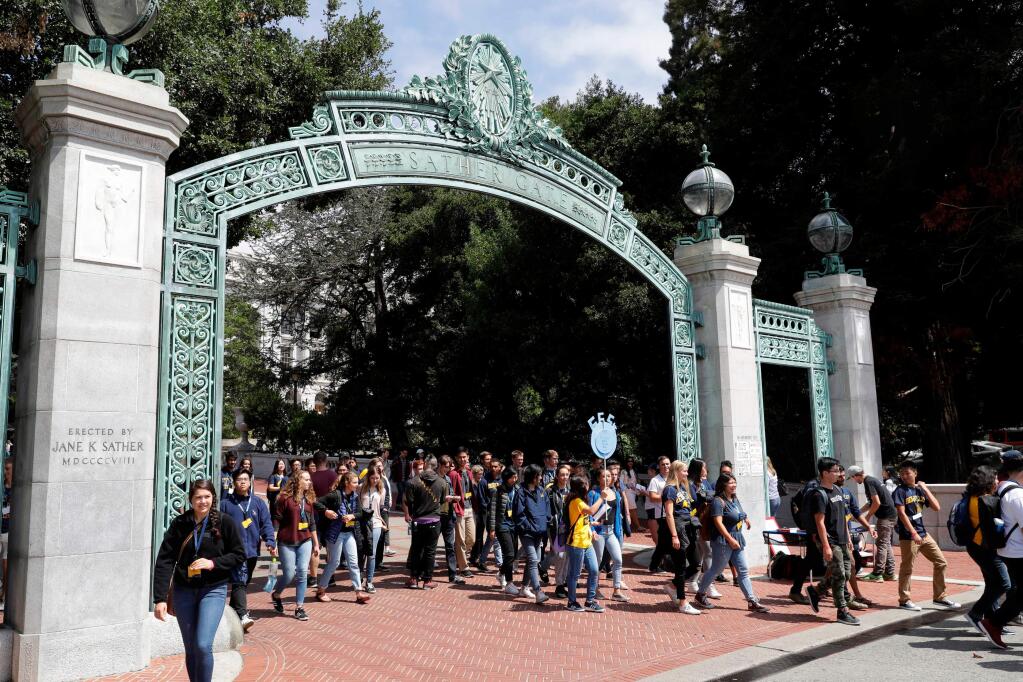 FILE - In this Aug. 15, 2017 file photo, students walk on the University of California, Berkeley campus in Berkeley, Calif. (AP Photo/Marcio Jose Sanchez, File)