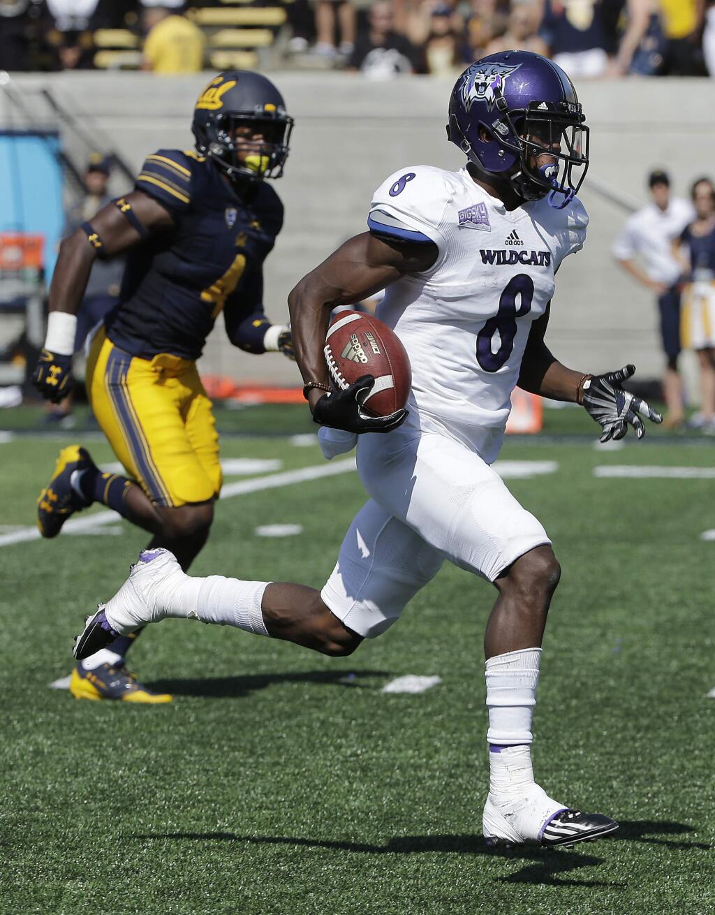 Weber State wide receiver Rashid Shaheed (8) runs past Cal linebacker Derron Brown (4) to score on a touchdown reception during in Berkeley, Saturday, Sept. 9, 2017. (AP Photo/Jeff Chiu)