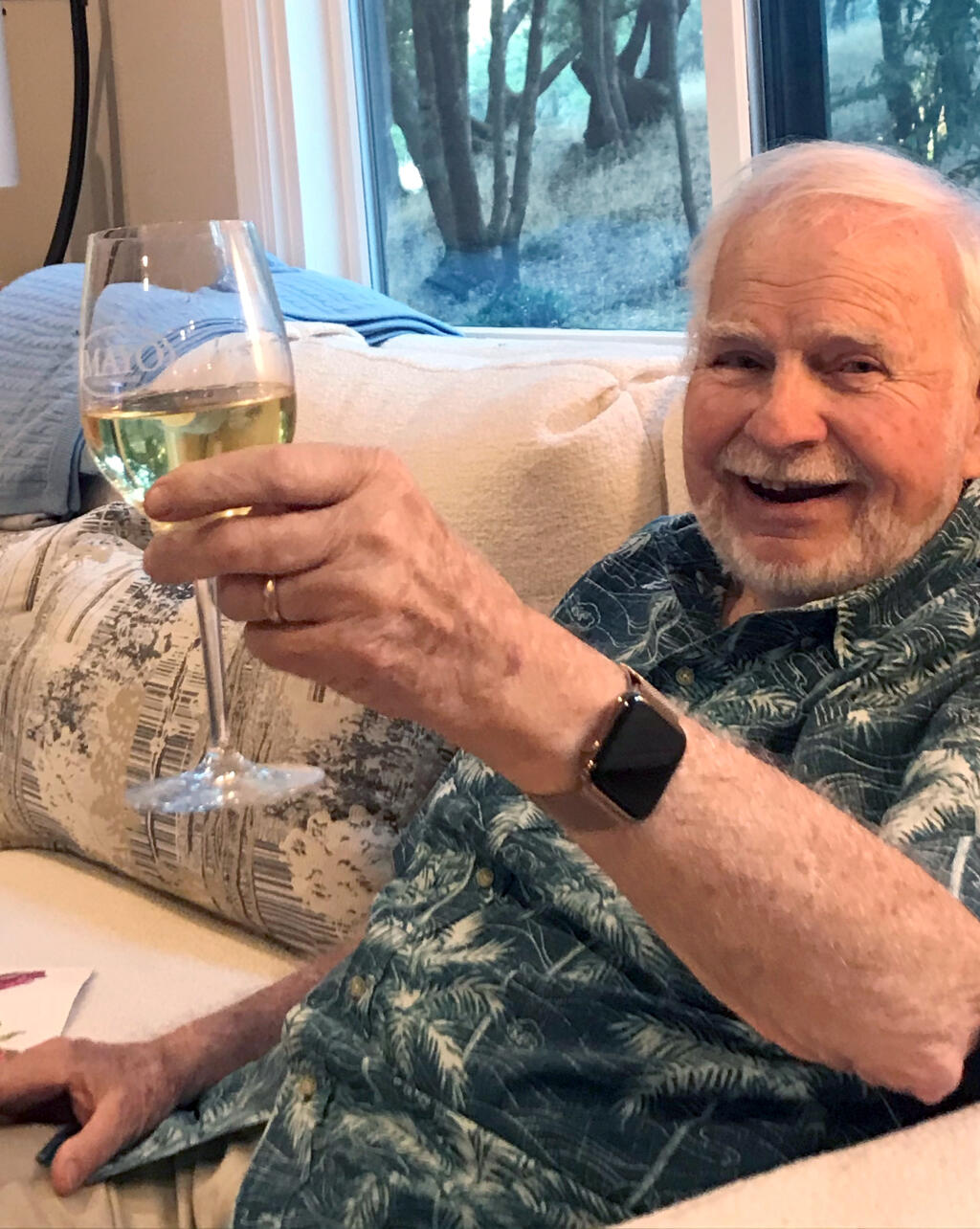 Henry Mayo enjoys a glass of his chardonnay at his Bennett Valley home in a recent family photo. Mayo died on Dec. 5, 2020. He was 86. (Submitted)