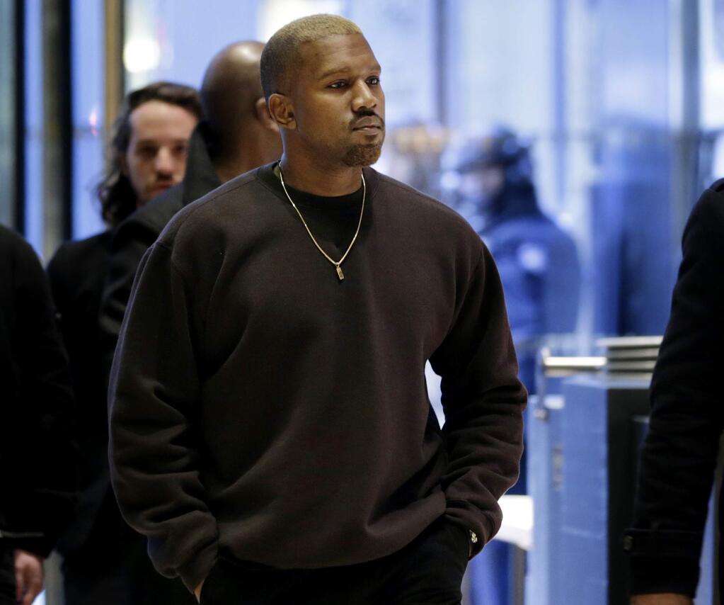 FILE - In this Dec. 13, 2016, file photo, Kanye West enters Trump Tower in New York. A new course at Washington University in St. Louis is focused on the world of Kanye West. The course titled 'Politics of Kanye West: Black Genius and Sonic Aesthetics,' began this week. (AP Photo/Seth Wenig, File)