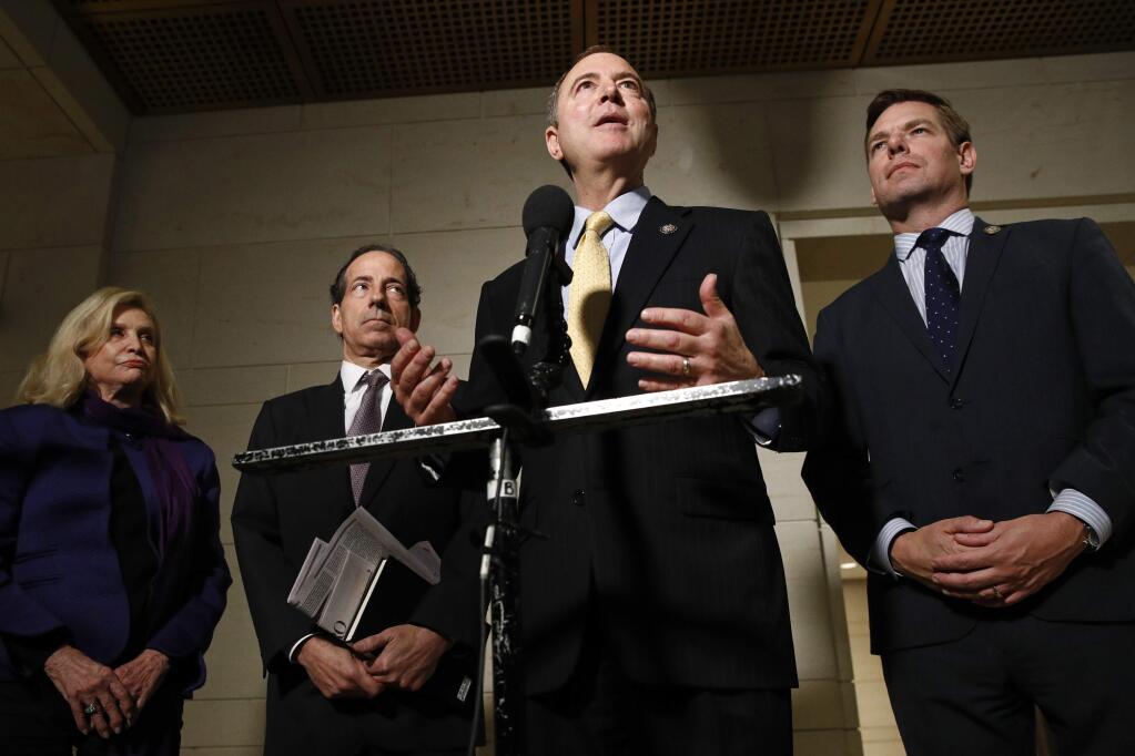 Rep. Adam Schiff, D-Calif., second from right, speaks with members of the media after former deputy national security adviser Charles Kupperman signaled that he would not appear as scheduled for a closed door meeting to testify as part of the House impeachment inquiry into President Donald Trump, Monday, Oct. 28, 2019, on Capitol Hill in Washington. Standing with Schiff are Carolyn Maloney, D-N.Y., from left, Rep. Jamie Raskin, D-Md., and Rep. Eric Swalwell, D-Calif. (AP Photo/Patrick Semansky)