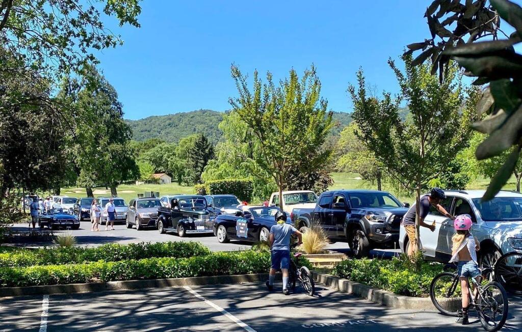 Friends and family stage a socially distant car parade at the Sonoma Golf Club to welcome COVID-19 survivor Jerry Kram home in April of 2020. A new library archive aims to document the story of the pandemic for future generations of Sonomans.