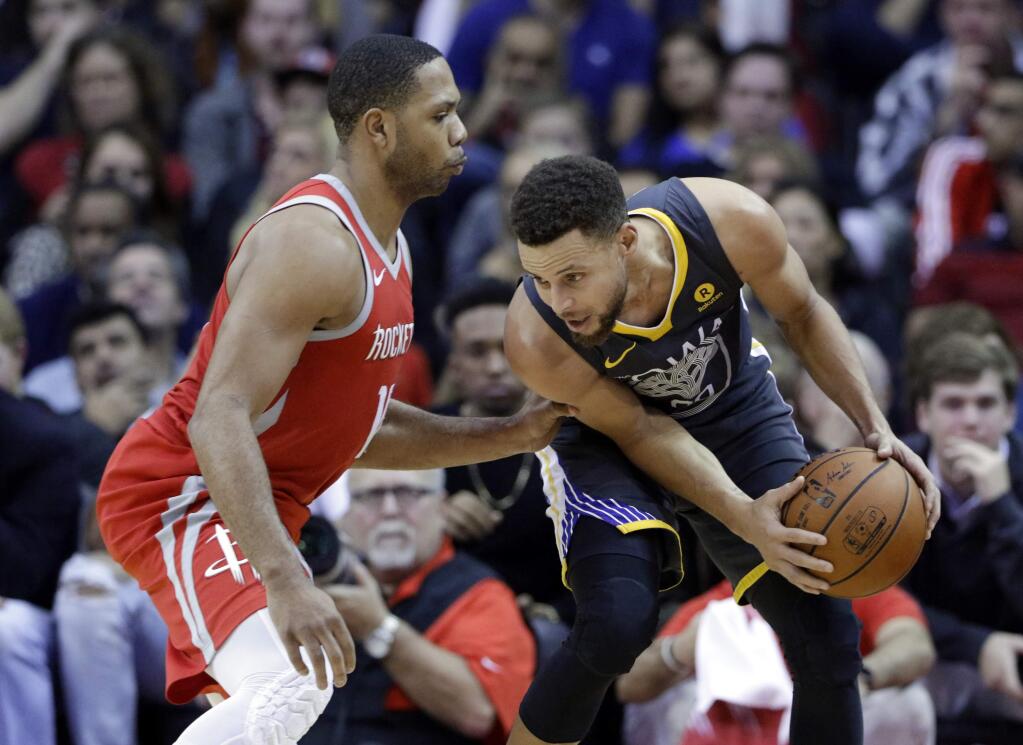 Golden State Warriors guard Stephen Curry (30) looks to get around Houston Rockets guard Eric Gordon (10) during the second half of an NBA basketball game Saturday, Jan. 20, 2018, in Houston. (AP Photo/Michael Wyke)