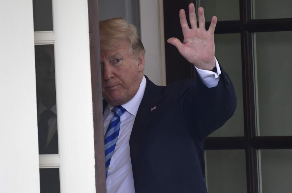 President Donald Trump waves to Uzbek President Shavkat Mirziyoyev as he leaves following a visit to the White House in Washington, Wednesday, May 16, 2018. (AP Photo/Susan Walsh)