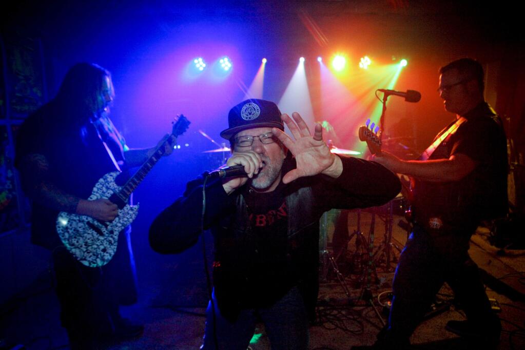 Petaluma, California, USA. Wednesday, November 29, 2017. _ Heavy metal rock band, Hellbender, rehearse in a garage in Petaluma. Lead vocals is 'Dollar Bill' of Santa Rosa. (PHOTO BY CRISSY PASCUAL/ARGUS-COURIER STAFF)