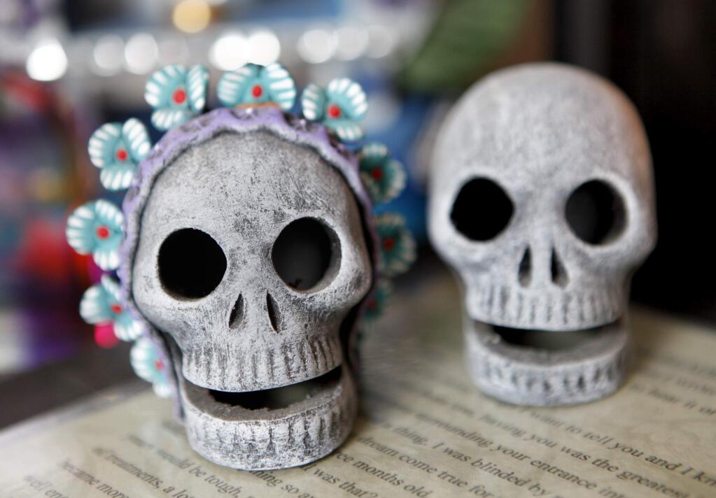 Decorative skulls are part of the Dia de los Muertos shrine that Margo Gallagher created for late son, Aaron, at her home in Petaluma, California on Thursday, October 18, 2012. (BETH SCHLANKER/ The Press Democrat)