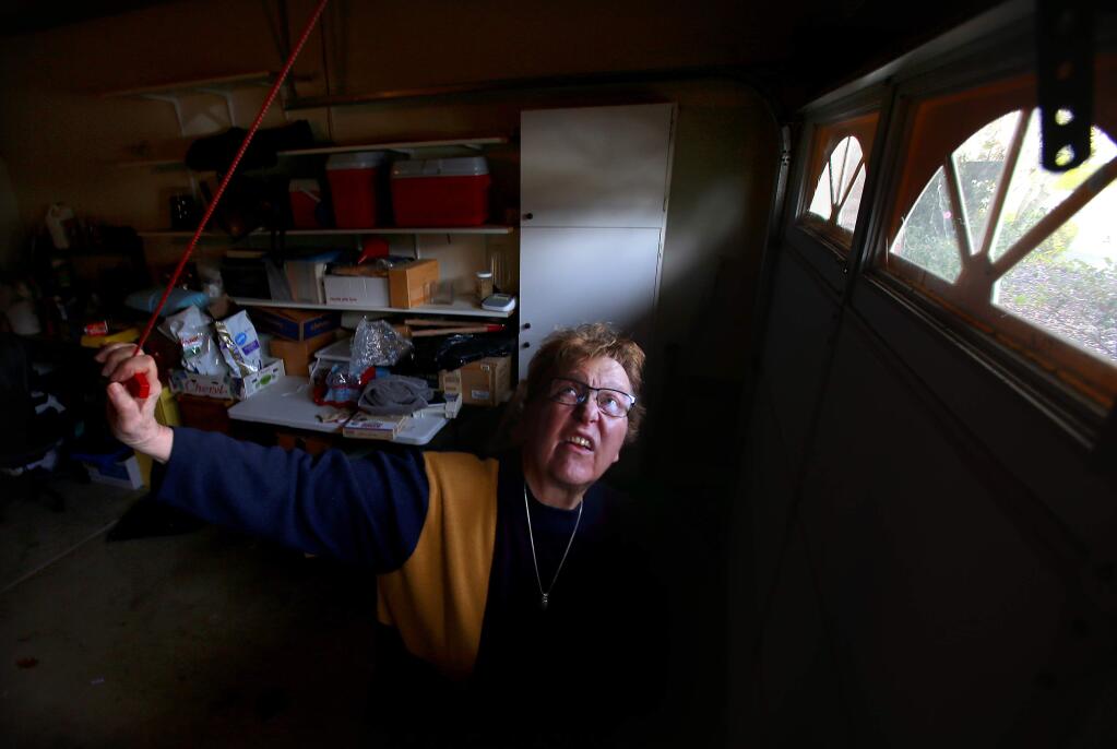 Oakmont resident Cheryl Diehm installed a backup battery to operate her garage door opener after she was unable to open her the door manually on the night of the fires. Diehm knew to pull the release latch but was unable to lift the heavy door when told to evacuate. (JOHN BURGESS/ PD)