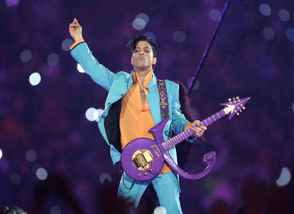 In this Feb. 4, 2007 file photo, Prince performs during the halftime show at the Super Bowl XLI football game at Dolphin Stadium in Miami. Prince, widely acclaimed as one of the most inventive and influential musicians of his era with hits including 'Little Red Corvette,' ''Let's Go Crazy' and 'When Doves Cry,' was found dead at his home on Thursday, April 21, 2016, in suburban Minneapolis, according to his publicist. He was 57. (AP Photo/Chris O'Meara, File)