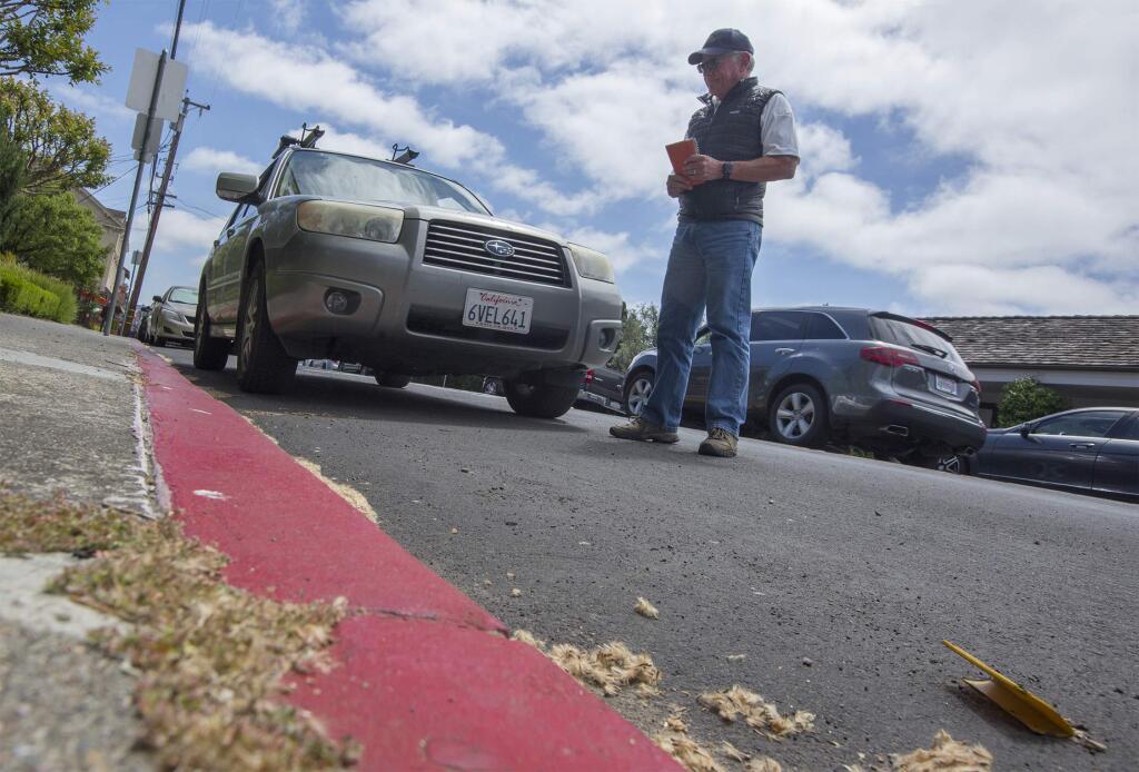Sonoma's City Prosecutor Bob Smith with a car parked illegally in a red zone on West Napa St. (Photo by Robbi Pengelly/Index-Tribune)