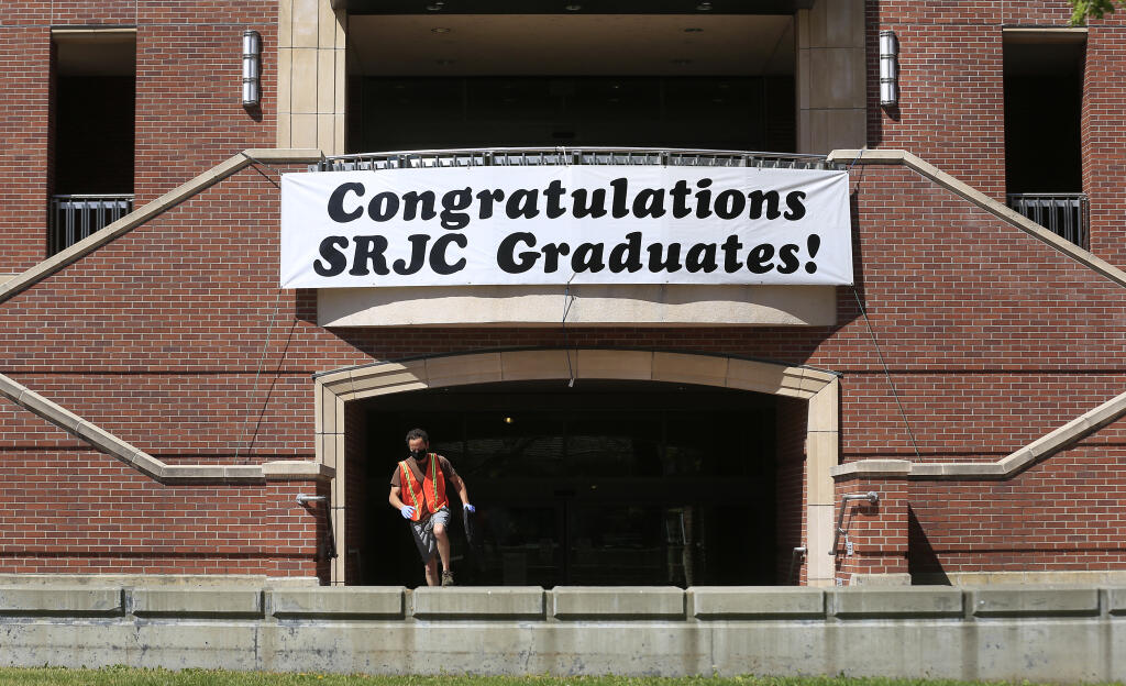 A banner congratulates graduates at the Frank P. Doyle Library on the Santa Rosa Junior College campus on April 13. (Kent Porter / The Press Democrat) 2021