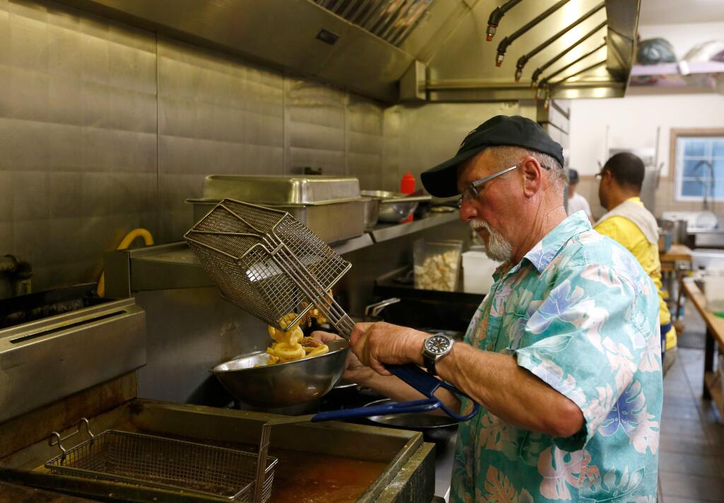 Chef/owner Roger Cramer prepares deep fried calamari at Stormy's Spirits and Supper, in Bloomfield, California on Saturday, October 8, 2016. (Alvin Jornada / The Press Democrat)
