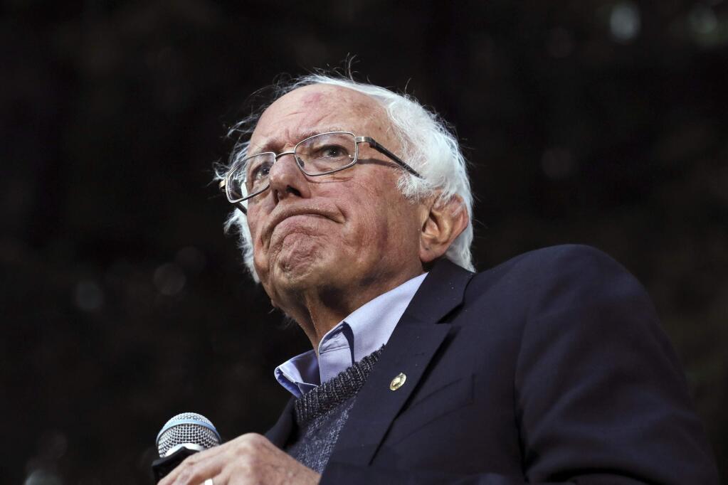 In this Sept. 29, 2019 photo, Democratic presidential candidate Sen. Bernie Sanders, I-Vt., pauses while speaking at a campaign event at Dartmouth College in Hanover, N.H. Sanders' campaign said Wednesday the Democratic presidential candidate has had a heart procedure for a blocked artery and that he's canceling events and appearances 'until further notice.' (AP Photo/ Cheryl Senter)