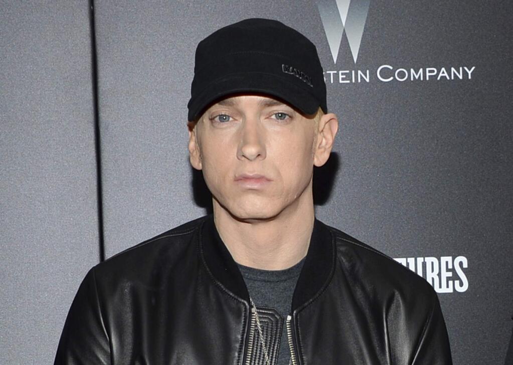 FILE - In this July 20, 2015, file photo, Eminem attends the premiere of 'Southpaw' in New York. Eminem has released a verbal tirade on President Donald Trump in a video that aired as part of the BET Hip Hop Awards on Oct. 10, 2017. (Photo by Evan Agostini/Invision/AP, File)
