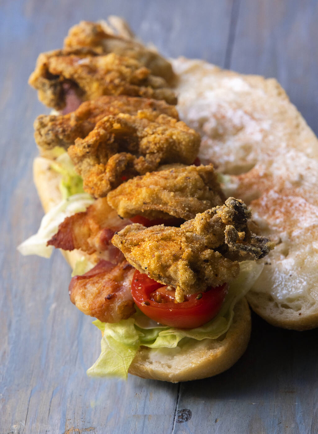 Fried Oyster Po' Boy from chef John Ash is “dressed” with bacon, lettuce and tomatoes.  (John Burgess/The Press Democrat)