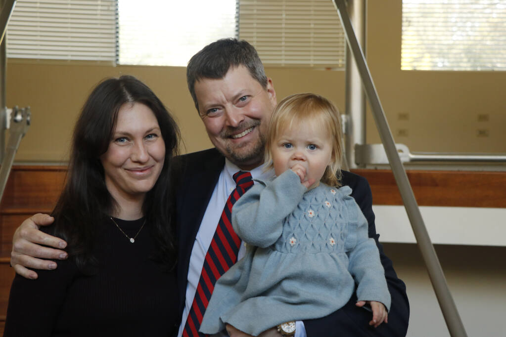 Samantha and John Loe, with their daughter Eva, inside what they hope becomes Loe Firehouse Cannabis Dispensary, in Glen Ellen, on March 19, 2021. (Sonoma Index-Tribune)