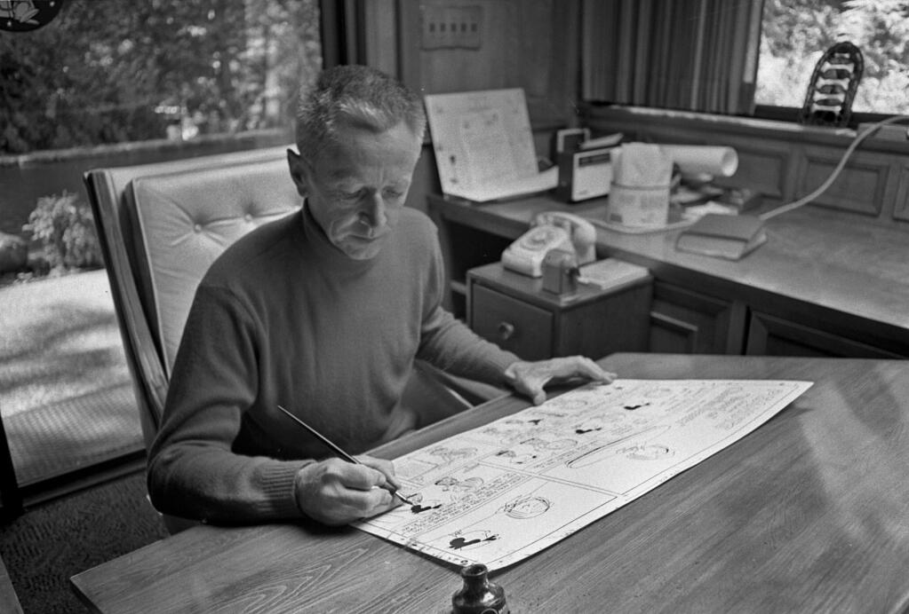 Charles M. Schulz at his drafting table, 1969. (Tom Vano, courtesy of the Charles M. Schulz Museum and Research Center, Santa Rosa)
