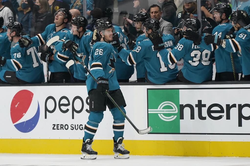 San Jose Sharks left wing Jasper Weatherby, center, is congratulated by teammates after scoring against the Winnipeg Jets during the second period in San Jose on Saturday, Oct. 16, 2021. (Jeff Chiu / ASSOCIATED PRESS)