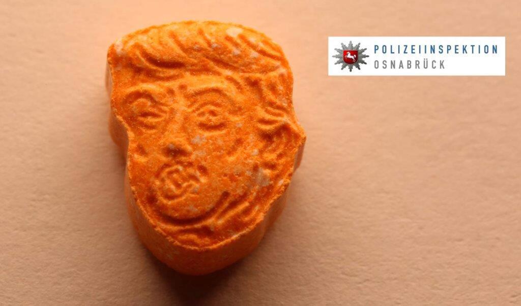 This undated picture provided by Polizeiinspektion Osnabrueck police shows an ecstasy pill. German police say they have seized thousands of ecstasy pills in the shape of President Donald Trump's head, a haul with an estimated street value of 39,000 euros ($45,900). Police in Osnabrueck, in northwestern Germany, say they found the drugs during a check Saturday evening on an Austrian-registered car on the A30 highway. (Police Osnabrueck via AP)