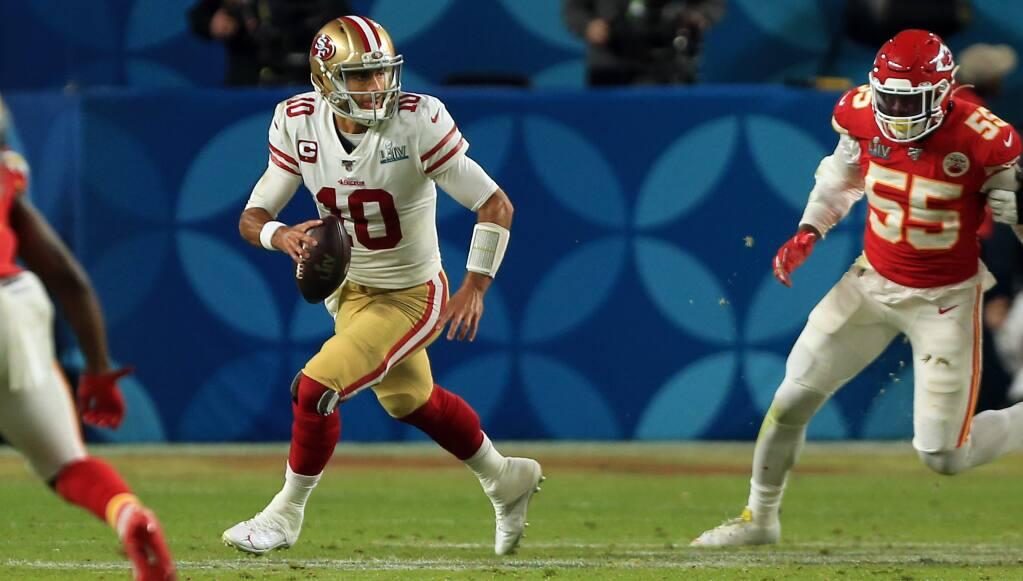 Jimmy Garoppolo is forced from the pocked by Frank Clark during San Francisco’s 31-20 Super Bowl 54 loss to the Kansas City Chiefs. (KENT PORTER/THE PRESS DEMOCRAT)