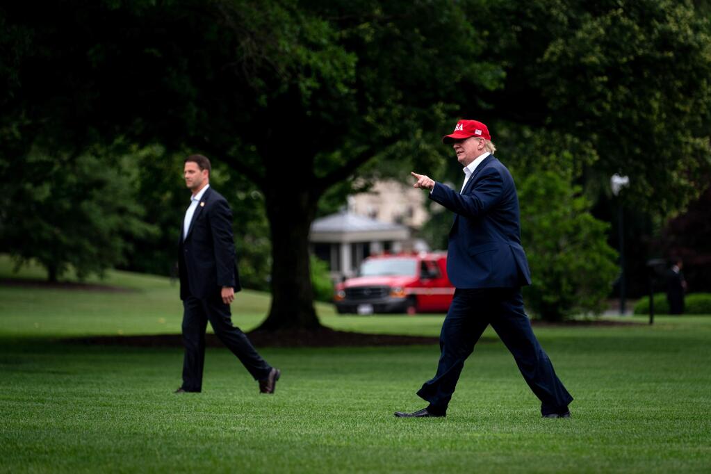 President Donald Trump walks across the South Lawn as he returns to the White House in Washington following a visit to Europe, on June 7, 2019. (Erin Schaff/The New York Times)