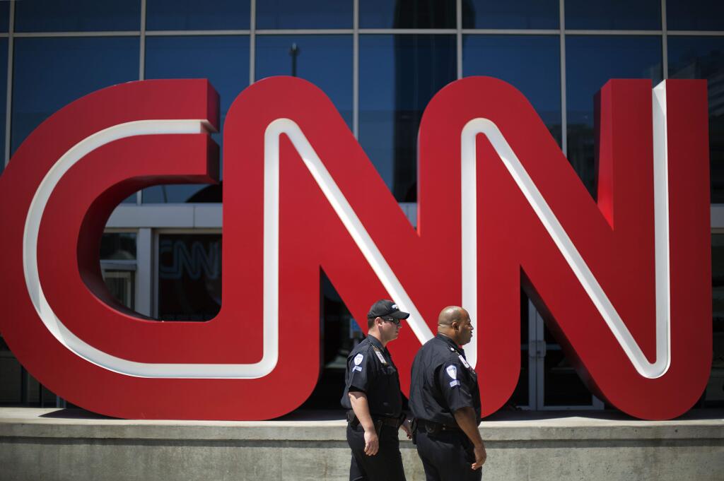 AT&T's proposed purchase of Time Warner may be held up by Justice Department's insistence on the sale of CNN. (DAVID GOLDMAN / Associated Press)