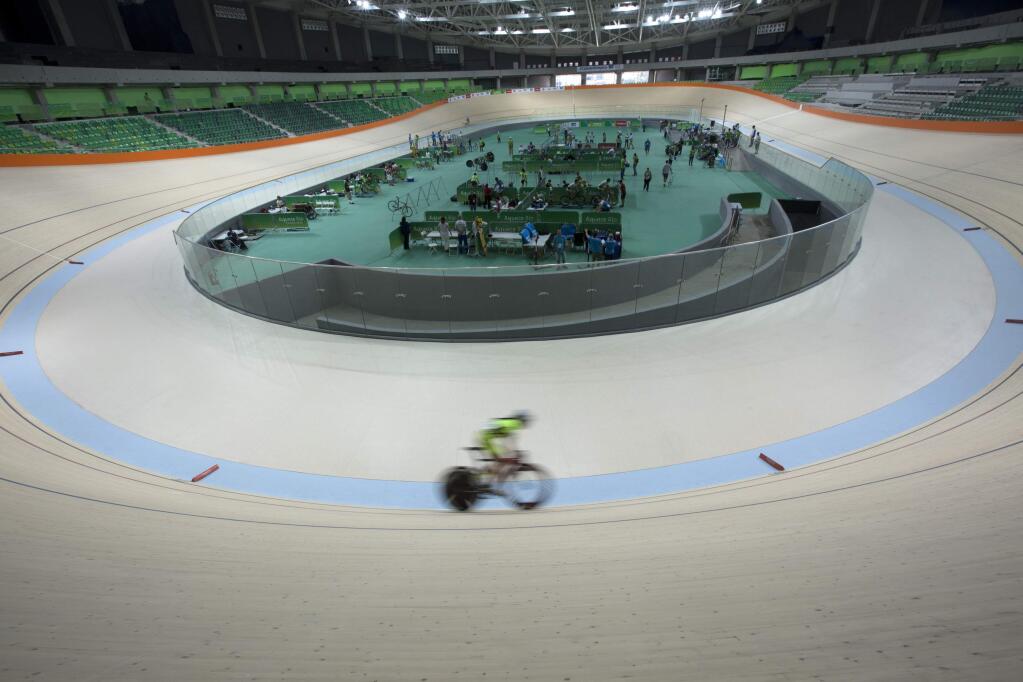 A cyclist rides his bike during a test event at the new velodrome, the last venue of the Rio 2016 Olympic Park to be delivered, in Rio de Janeiro, Brazil, Sunday, June 26, 2016. Rio will become the first South American city to host the Summer Olympics. (AP Photo/Silvia Izquierdo)