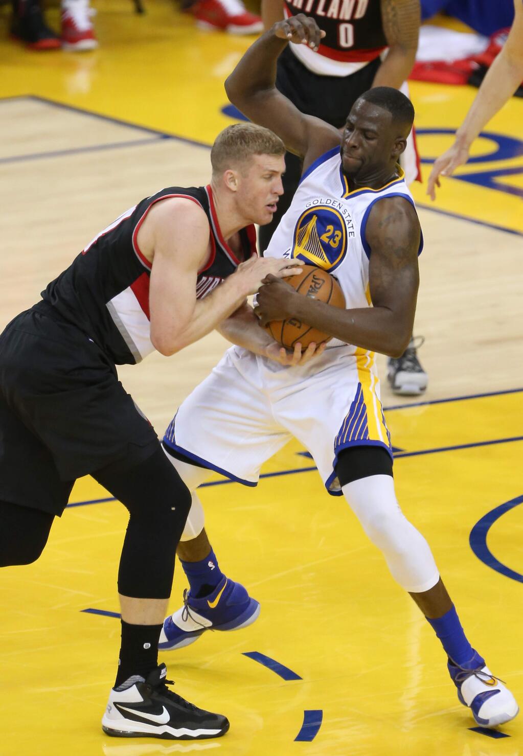 Golden State Warriors forward Draymond Green steals the ball away from Portland Trail Blazers center Mason Plumlee, during their game in Oakland on Sunday, May 1, 2016. The Warriors defeated the Trail Blazers 118-106. (Christopher Chung/ The Press Democrat)