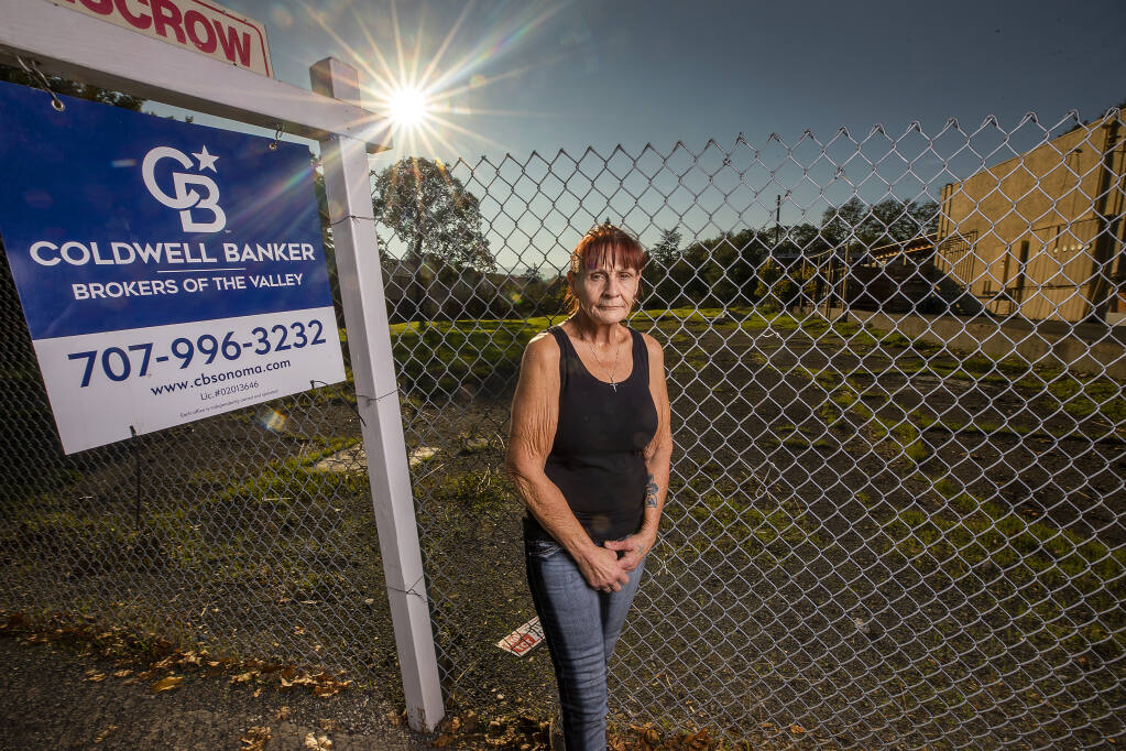 Amber Gill, 61, who has been homeless on and off for over a decade, stands in a proposed site for new low or no-cost tiny homes and eventual long term housing in Sonoma on Friday, Nov. 12, 2021. Sonoma County is applying for funding from the state for up to eight new homeless housing sites through Project Homekey. (John Burgess/The Press Democrat)