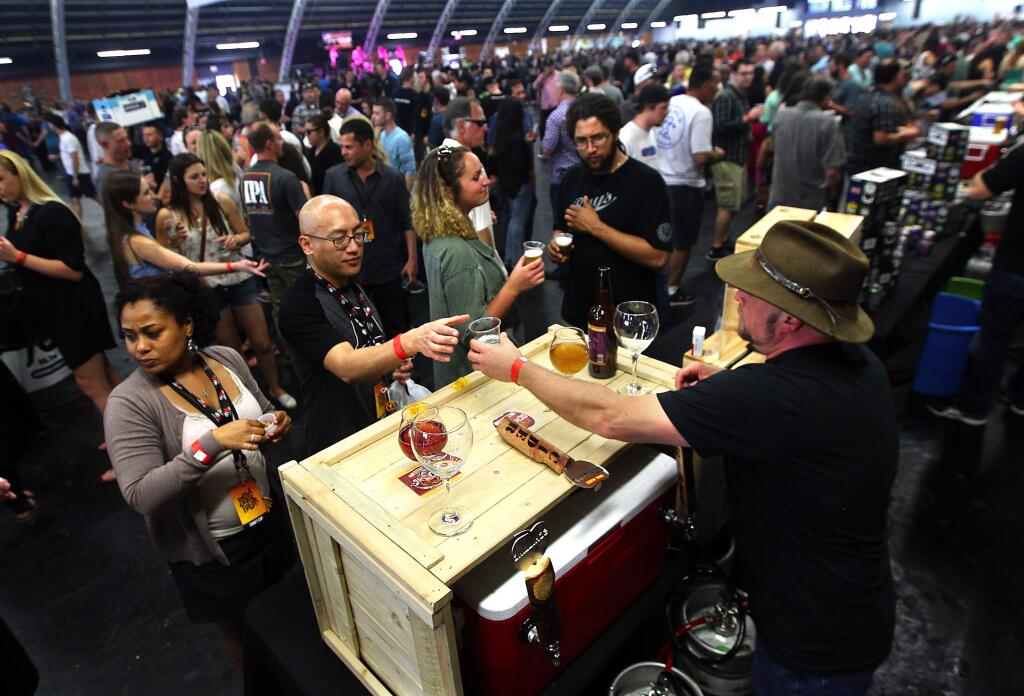 Over 70 craft beer brewers and cider makers served samples at the Battle of the Brews at the Sonoma County Fairgrounds on Saturday, March 28, 2015. (Photo by John Burgess/The Press Democrat)