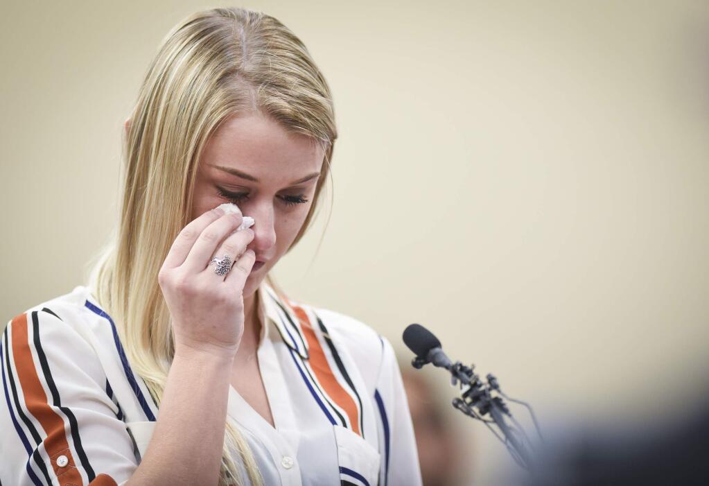 MSU student and former gymnast Christine Harrison gives her victim impact statement Thursday, Jan. 18, 2018, in Circuit Judge Rosemarie Aquilina's courtroom during the third day of victim impact statements regarding former sports medicine doctor Larry Nassar, who pled guilty to seven counts of sexual assault in Ingham County, and three in Eaton County. (Matthew Dae Smith /Lansing State Journal via AP)