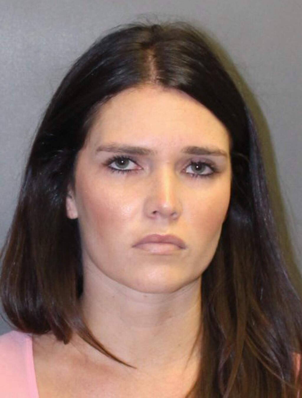 This undated booking photo provided by the Newport Beach, Calif., Police Department shows Cerissa Laura Riley, 31. She and a co-defendant, Grant W. Robicheaux, 38, a California doctor who appeared in a reality TV dating show, have been charged with drugging and sexually assaulting two women, and authorities suspect there may be many more victims. Orange County District Attorney Tony Rackauckas announced charges Tuesday, Sept. 18, 2018, against Robicheaux of Newport Beach and Riley of Brea. (Newport Beach Police Department via AP)