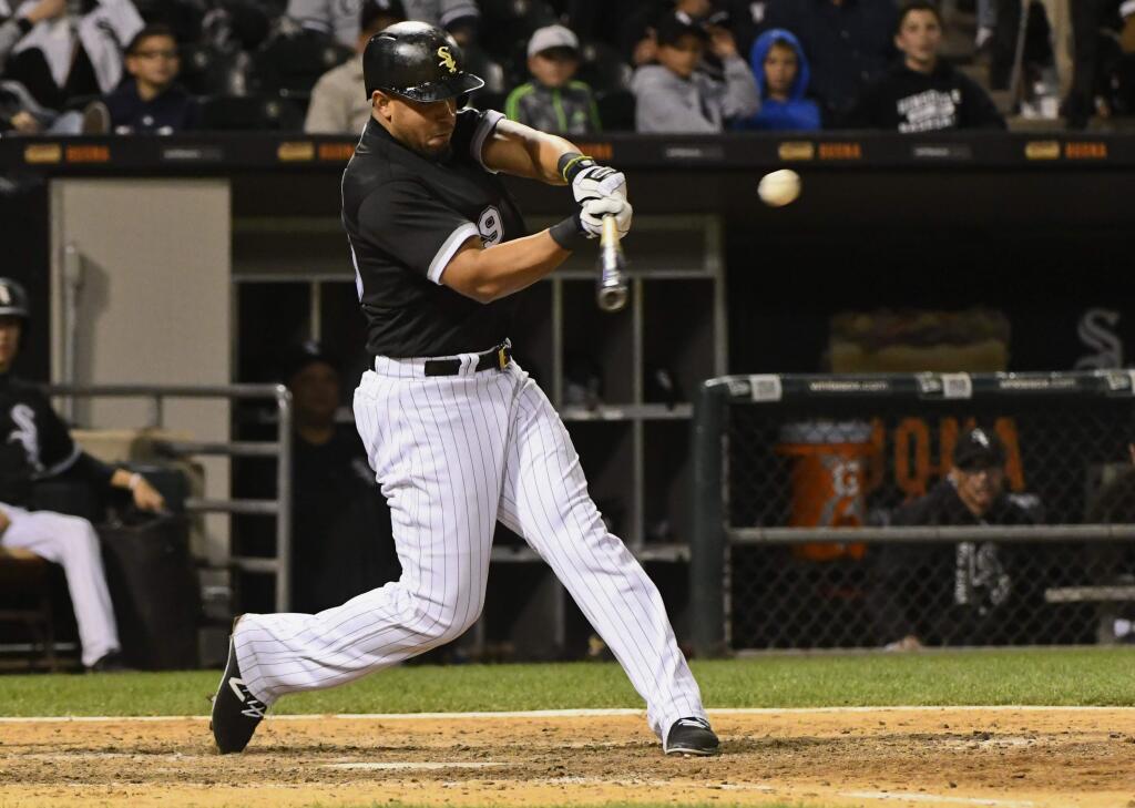 Chicago White Sox's Jose Abreu hits a triple against the San Francisco Giants during the eighth inning in Chicago on Saturday, Sept. 9, 2017. (AP Photo/Matt Marton)